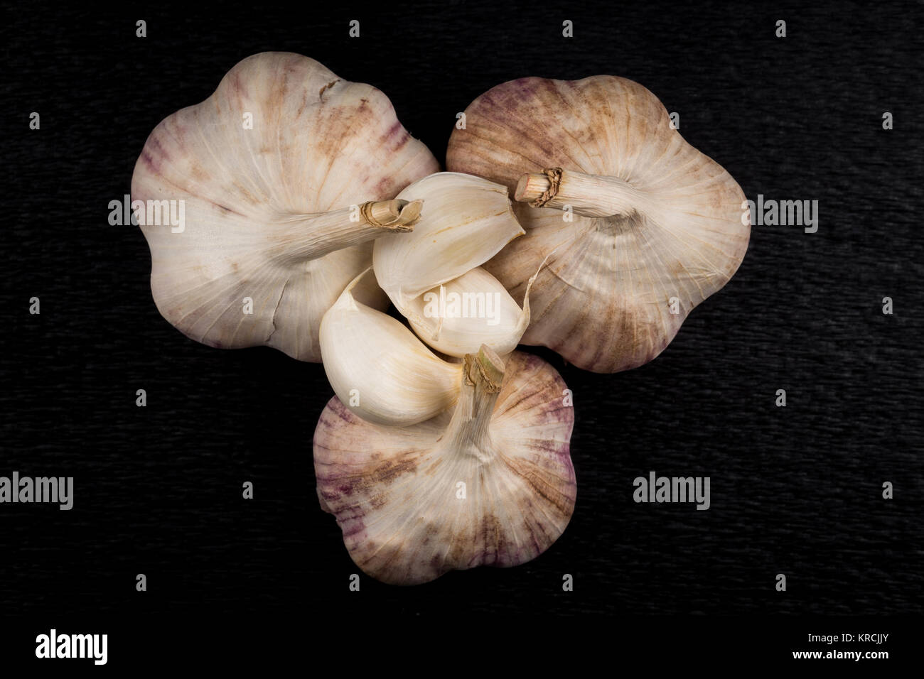 Garlic bulb on dark background Stock Photo - Alamy