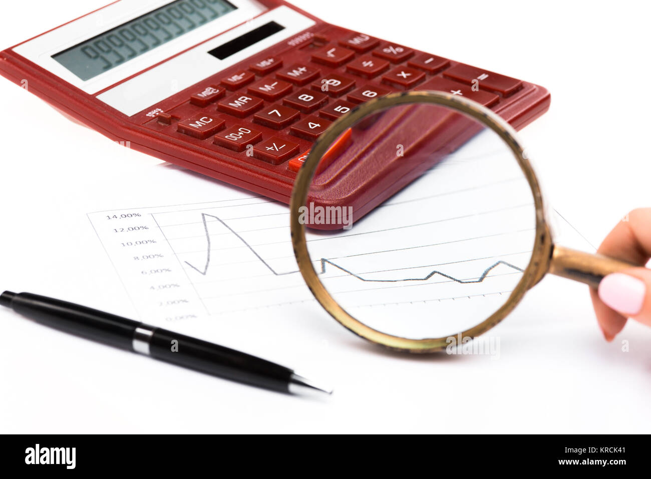 Magnifying glass with chart on paper Stock Photo - Alamy