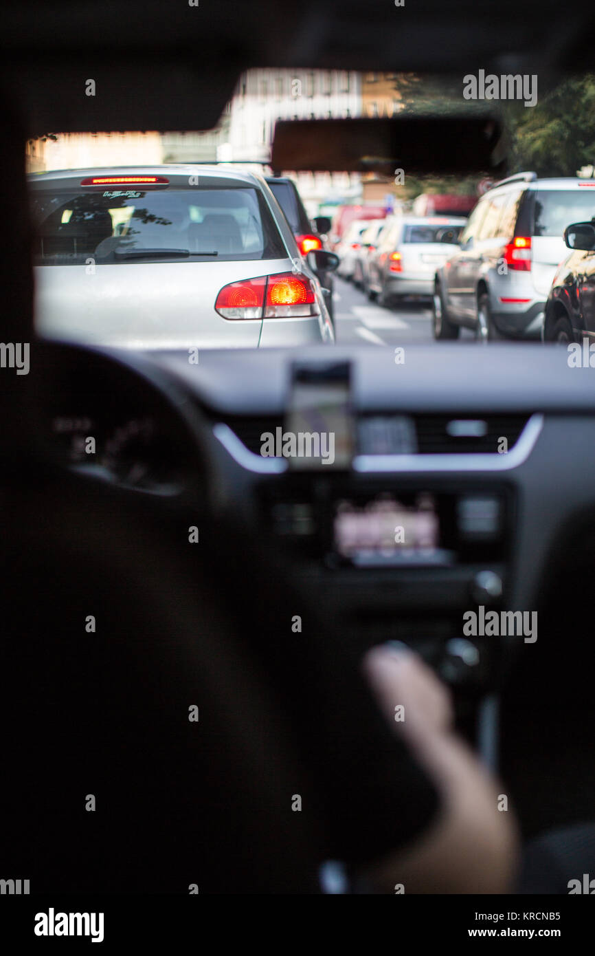 Traffic jam in a city with row of cars on the road during rush hour ...