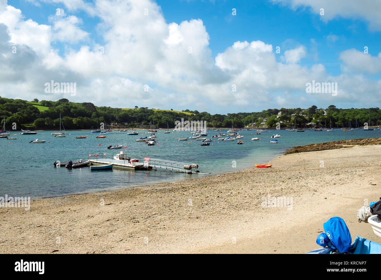 Water taxi passenger ferry waits at the pontoon on Helford Passage beach on the Helford River in Cornwall, UK Stock Photo