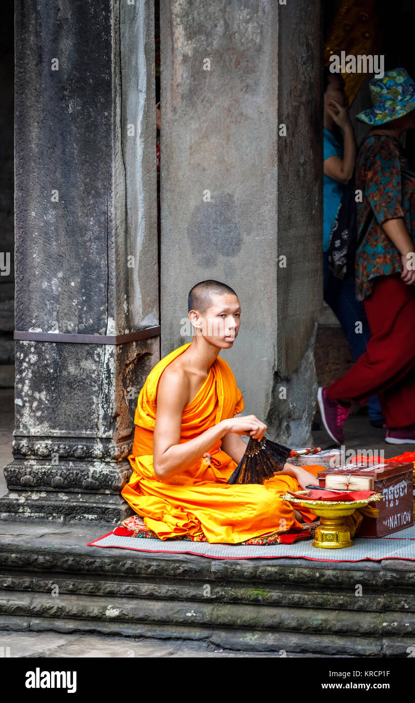 Seated monk in saffron robes hires stock photography and images Alamy
