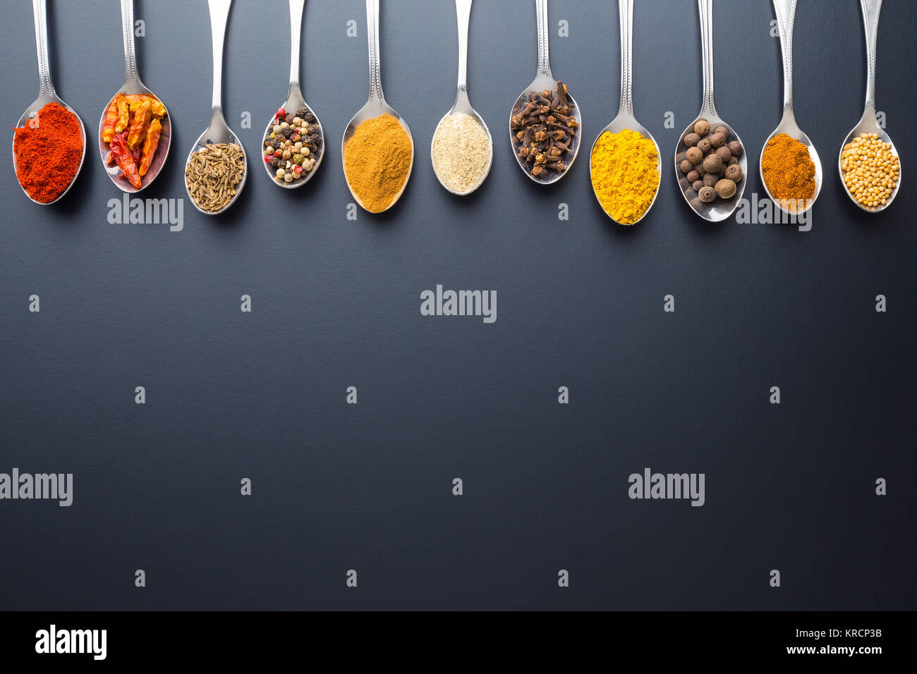 Various spices in spoons. Stock Photo