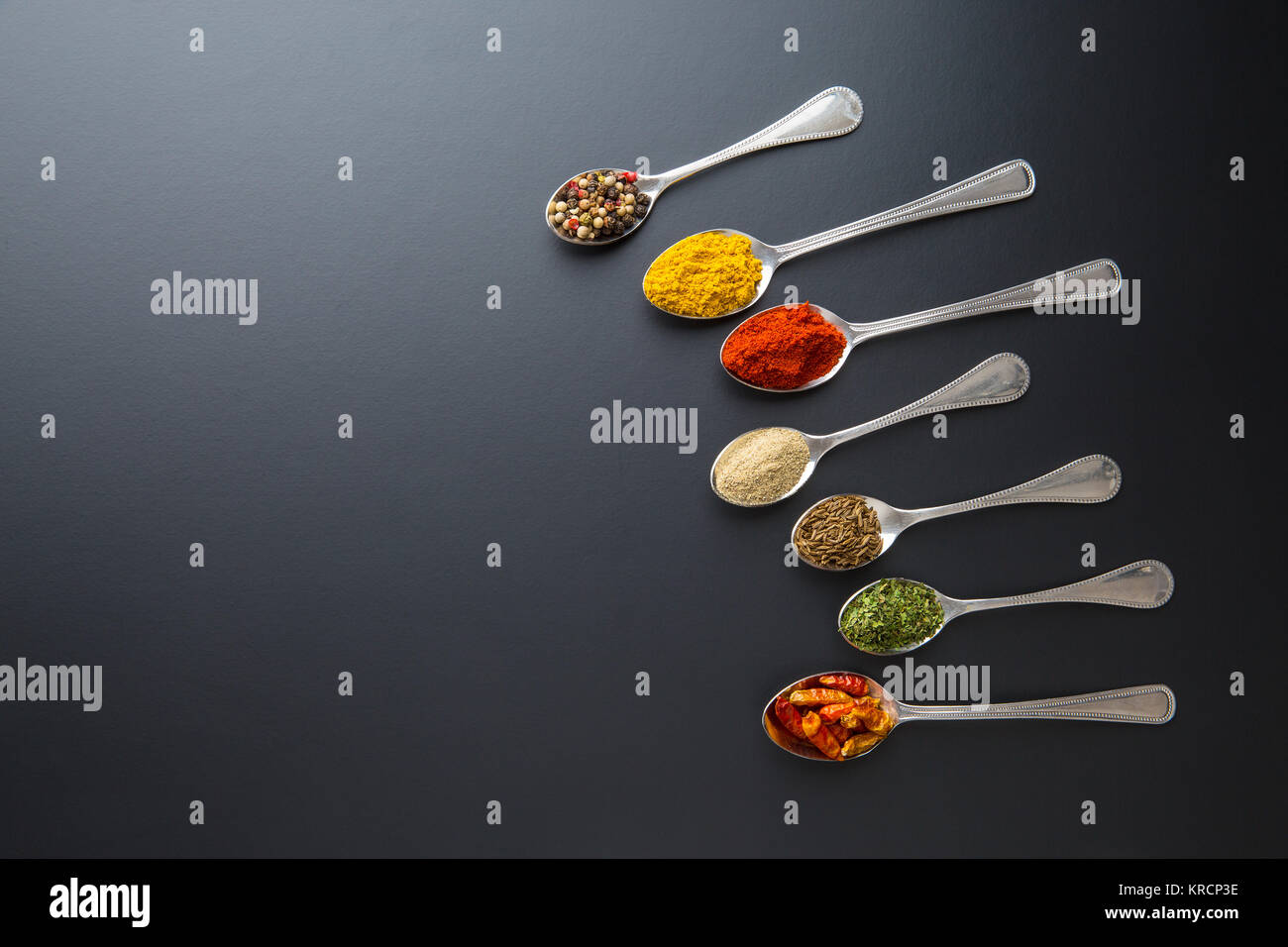Various spices in spoons. Stock Photo
