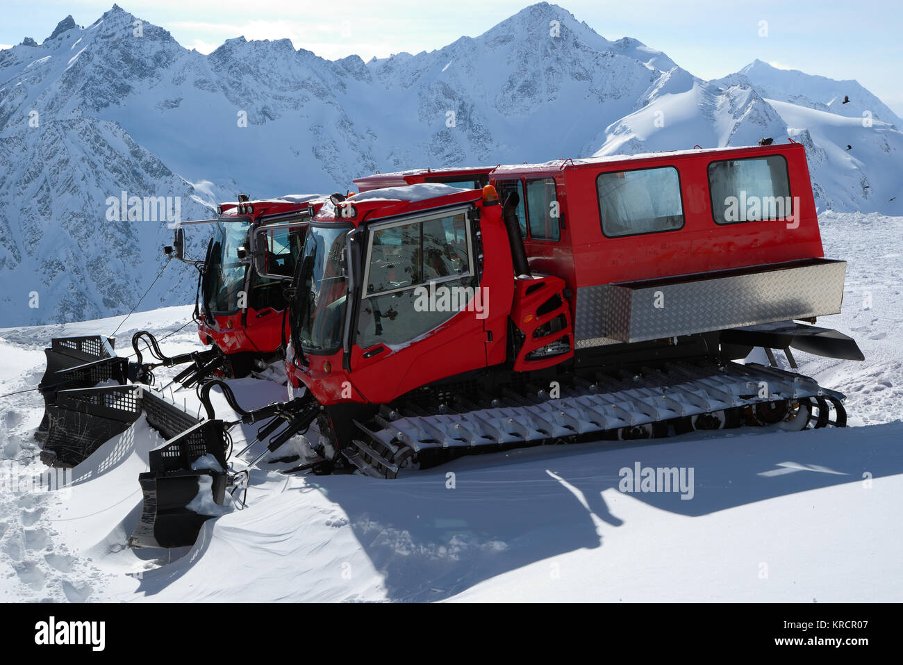 Two snowcat standing high in the mountains Stock Photo Alamy