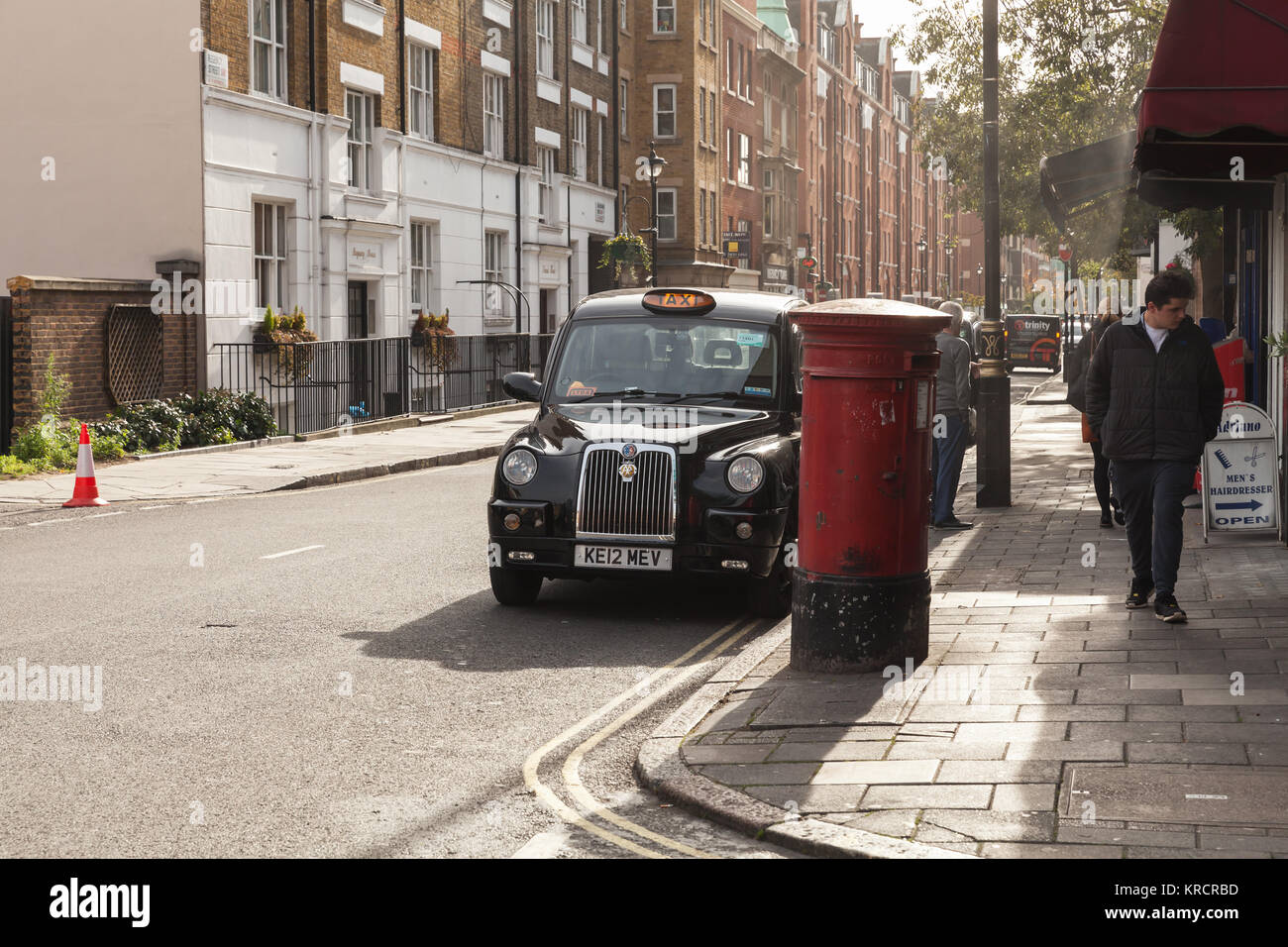 London, United Kingdom - October 30, 2017: Black taxi cab by The London Taxi Company stands on the street Stock Photo