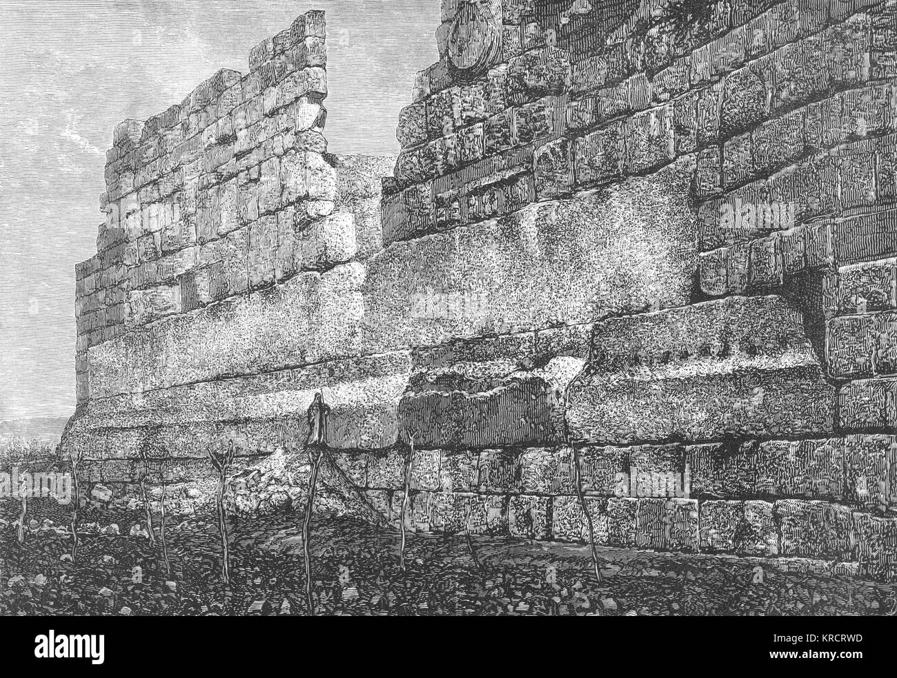 The Temple platform, showing the massive stones whose size (note the figure standing by them !) has led some to conjecture that otherworldly beings were responsible Date: 1880 Stock Photo