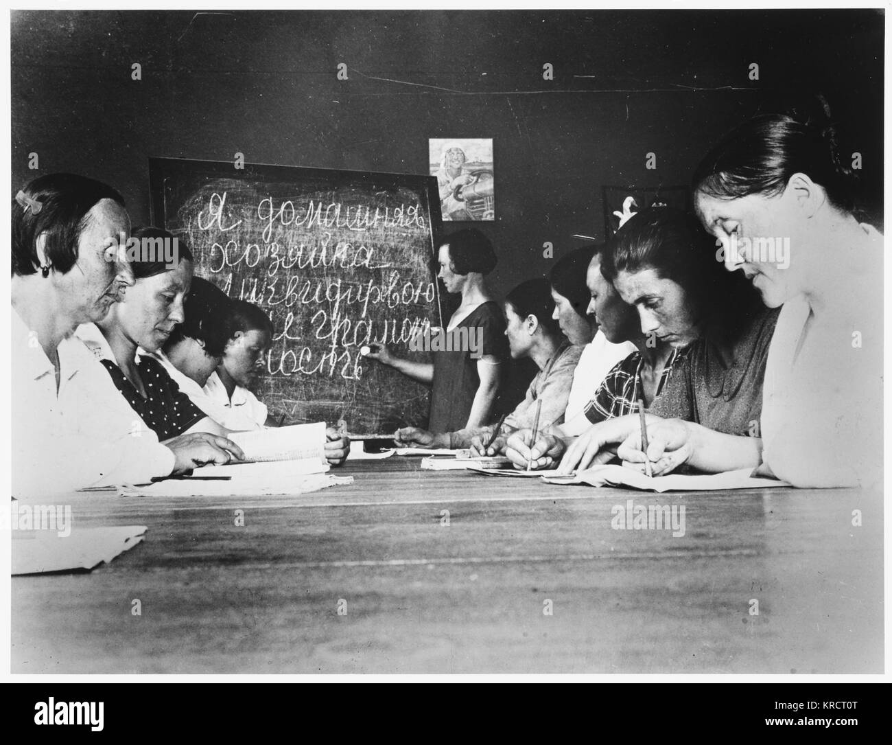 Housewives (inc. Anna Filippova) attend literacy classes ('The Liquidating Illiteracy Circle for Housewives') Date: 1931 Stock Photo