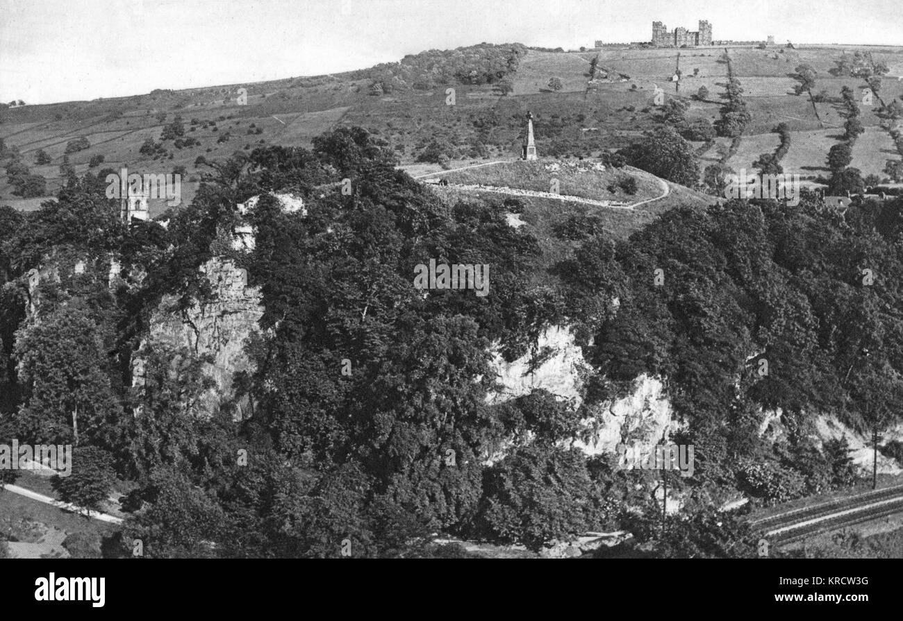 View of the Pic Tor War Memorial (centre, built in 1922) and Riber Castle on the distant horizon, overlooking Matlock, Derbyshire. Date: circa 1920s Stock Photo