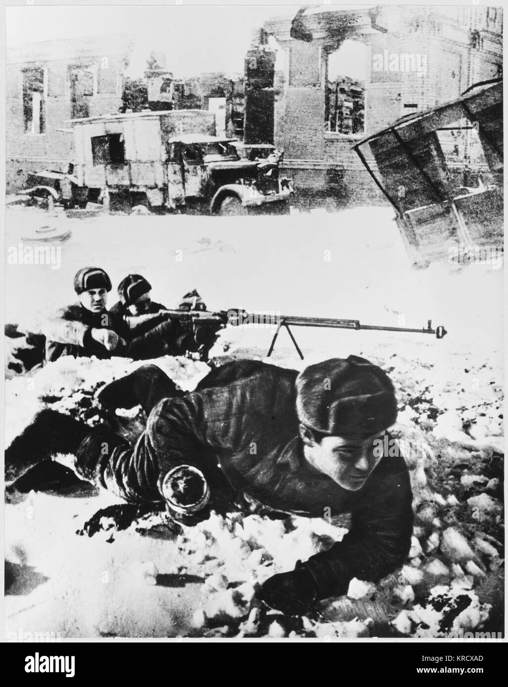 Red Army soldies lie in wait  amongst the ruins         Date: 1942 - 1943 Stock Photo