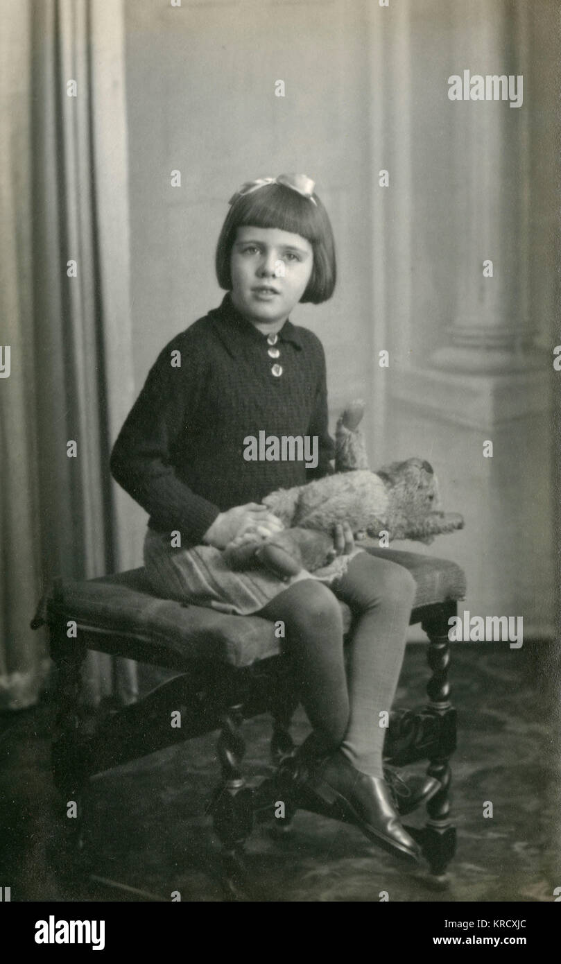 Studio photo of young girl and teddy bear Stock Photo