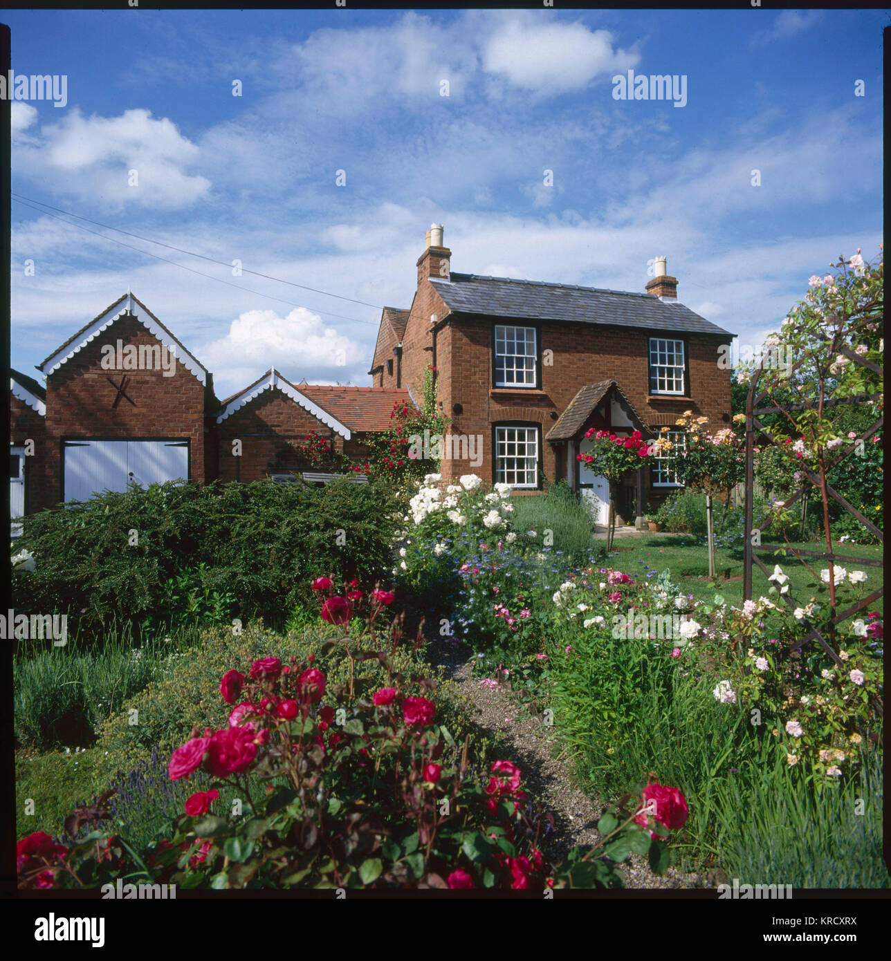 SIR EDWARD ELGAR This lovely English country  house, with roses in the  garden, is the birthplace of  composer Sir Edward Elgar (1857 - 1934).     Date: 1997 Stock Photo