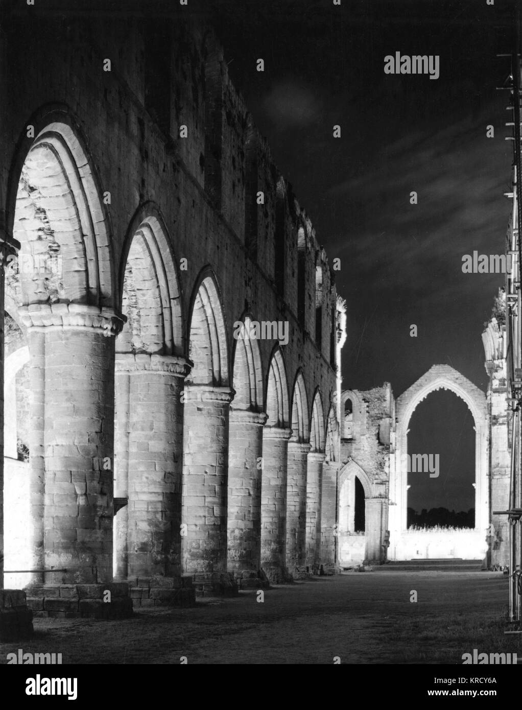 Night study of the floodlit Nave of Fountains Abbey, Yorkshire, England, a Cistercian abbey, founded in 1132. Stock Photo
