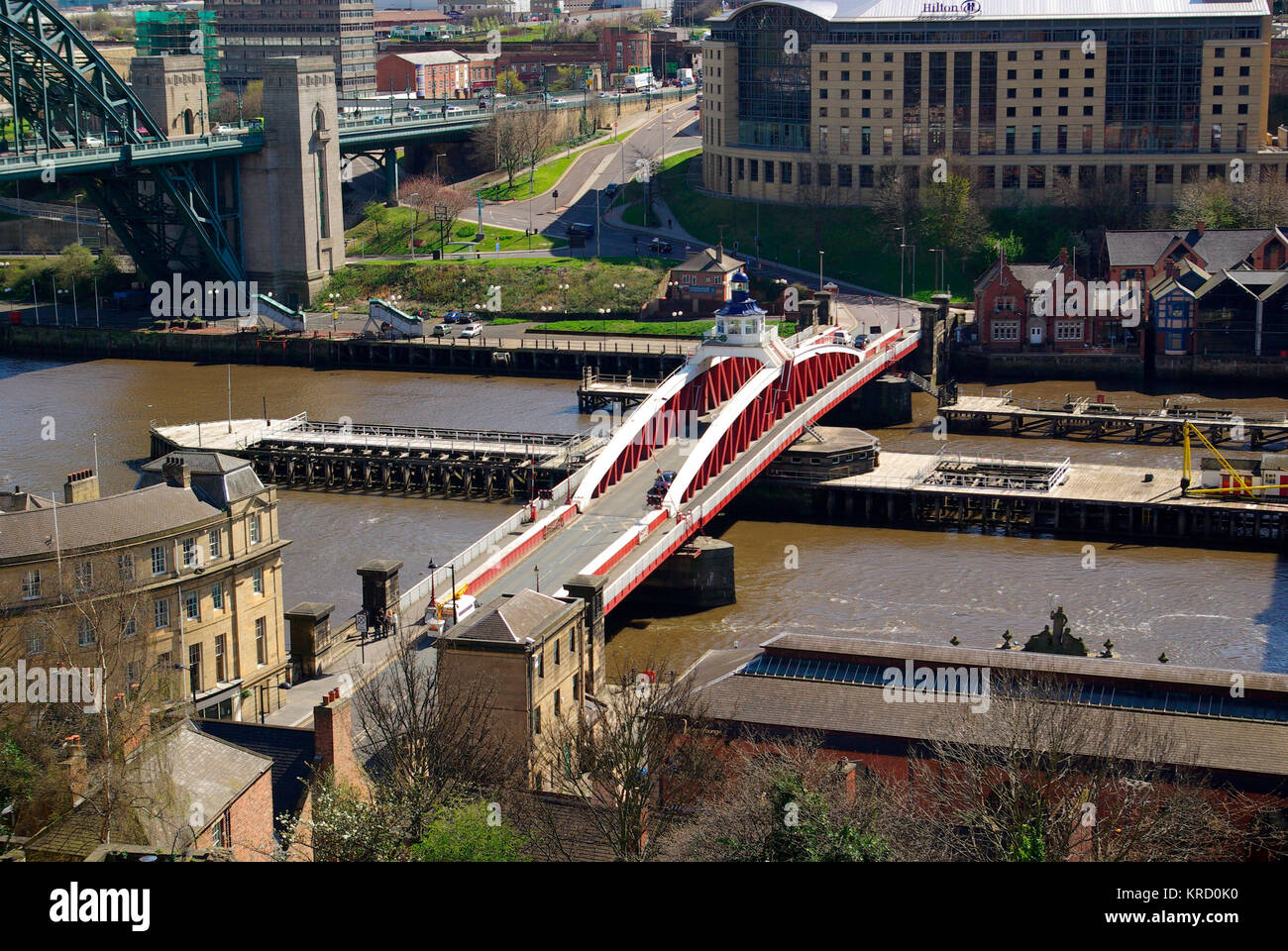 The view from the top of the Keep of Newcastle Castle, looking toward the The Swing Bridge over the River Tyne, which connects Gateshead and Newcastle upon Tyne, between the Tyne Bridge and the High Level Bridge. The mechanism used to move the bridge is still the same machinery originally installed by Sir William George Armstrong, 1st Baron Armstrong (1810 û 1900), a Tyneside industrialist who was the effective founder of the Armstrong Whitworth manufacturing empire. Stock Photo