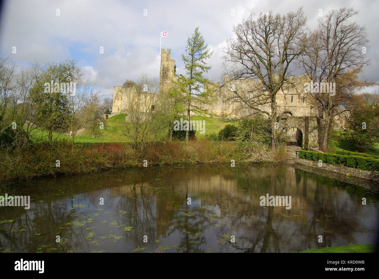 A view across the water of Prudhoe Castle, Northumberland. The building ...