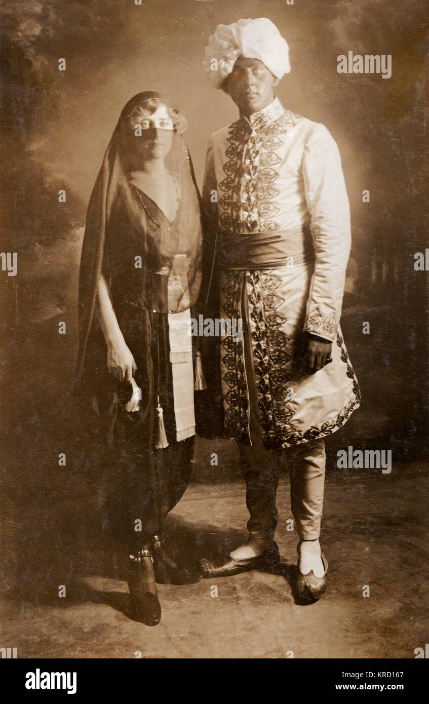The actress and singer Phyllis Dare (1890-1975) with her elder brother Jack.  They are dressed in costume for an Arabian Nights Ball.       Date: circa 1909 Stock Photo