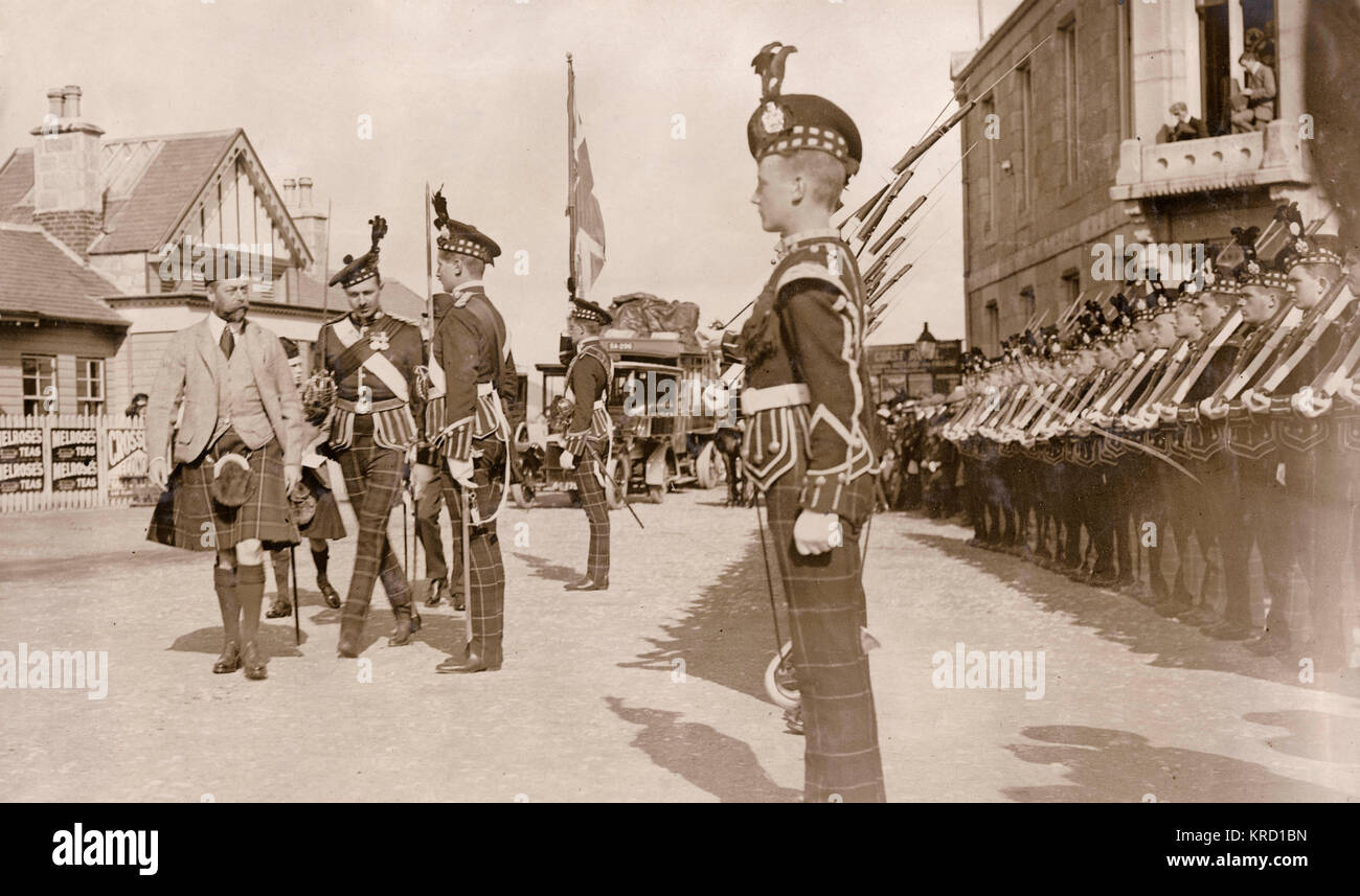 The Prince of Wales (soon to be George V) arriving at Ballater en route for Abergeldie Castle, in Aberdeenshire, Scotland.  He is seen here inspecting the guard of honour at the railway station.      Date: circa 1909 Stock Photo