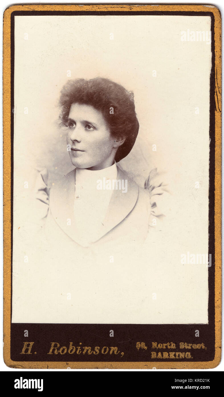 A young Victorian woman in a head and shoulders portrait.  She is wearing a jacket with high puffed sleeves.       Date: circa 1880s Stock Photo