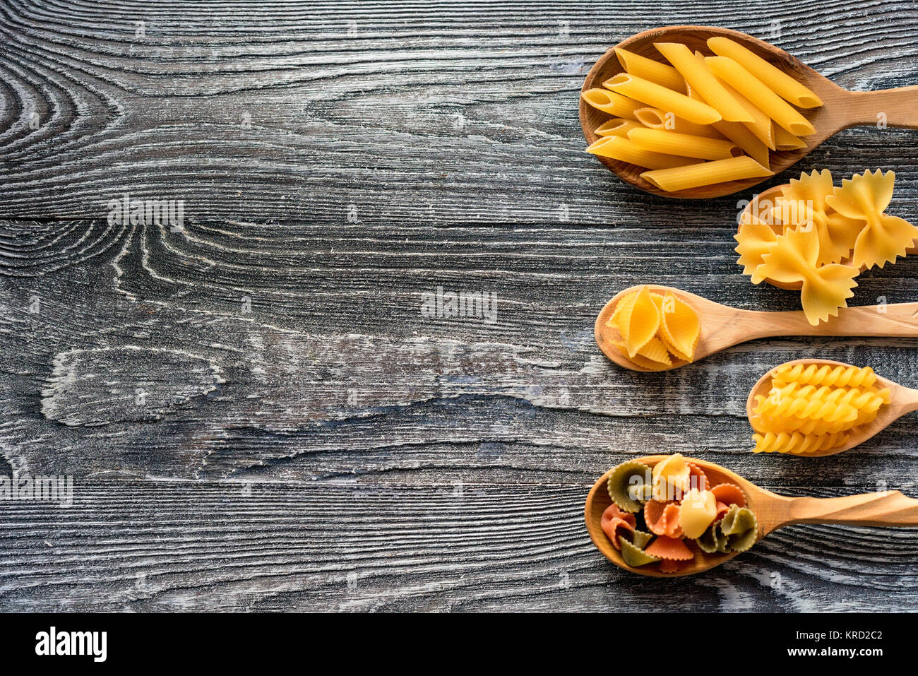 Various mix of pasta on wooden rustic background Stock Photo - Alamy