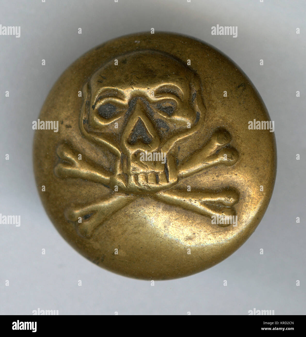 Skull and crossbones military button Stock Photo