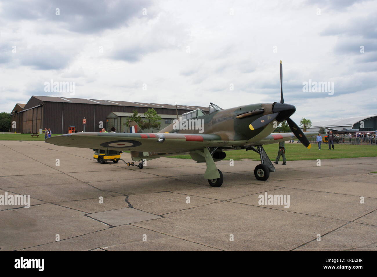 A Hurricane fighter plane, active during the Second World War, on an airfield, possibly at an air museum. Stock Photo