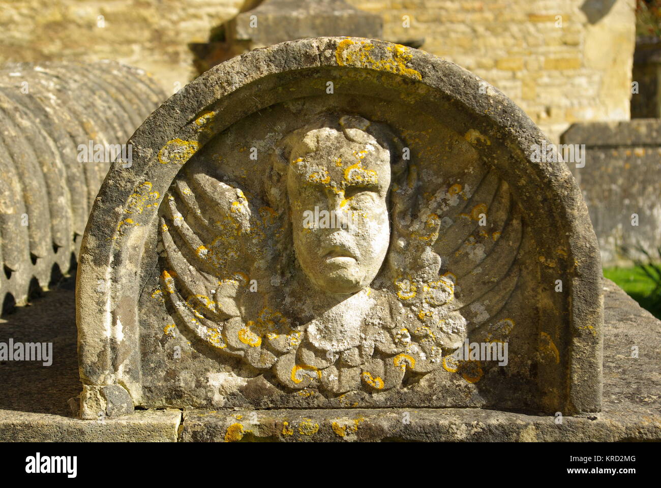 Tombstone detail in the churchyard of St Mary's Church, in the village of Bibury, Cotswolds, Gloucestershire. Stock Photo
