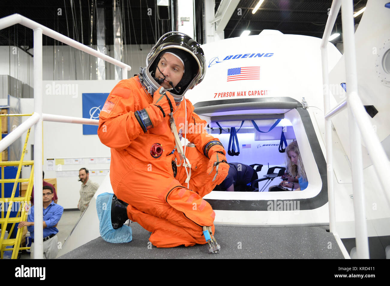 NASA astronaut Randy Bresnik prepares to enter the CST-100 spacecraft ...