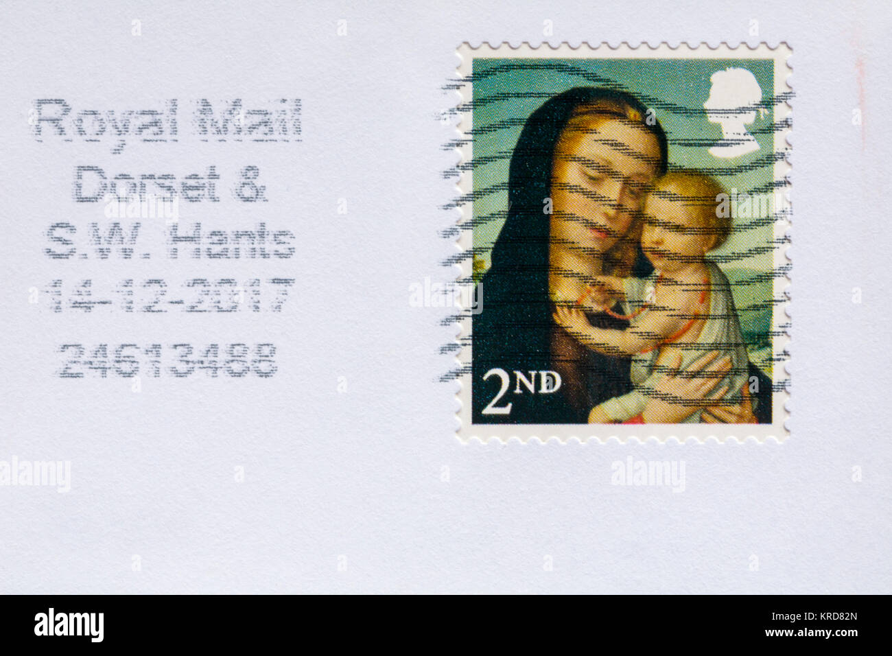 2nd class Christmas stamp with Madonna and child stuck on envelope