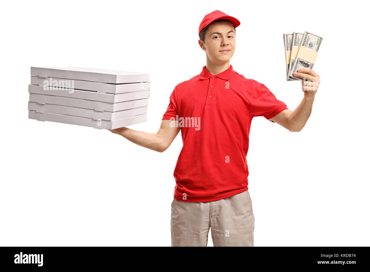 Teenage pizza delivery boy holding a stack of pizza boxes and bundles of money isolated on white background Stock Photo