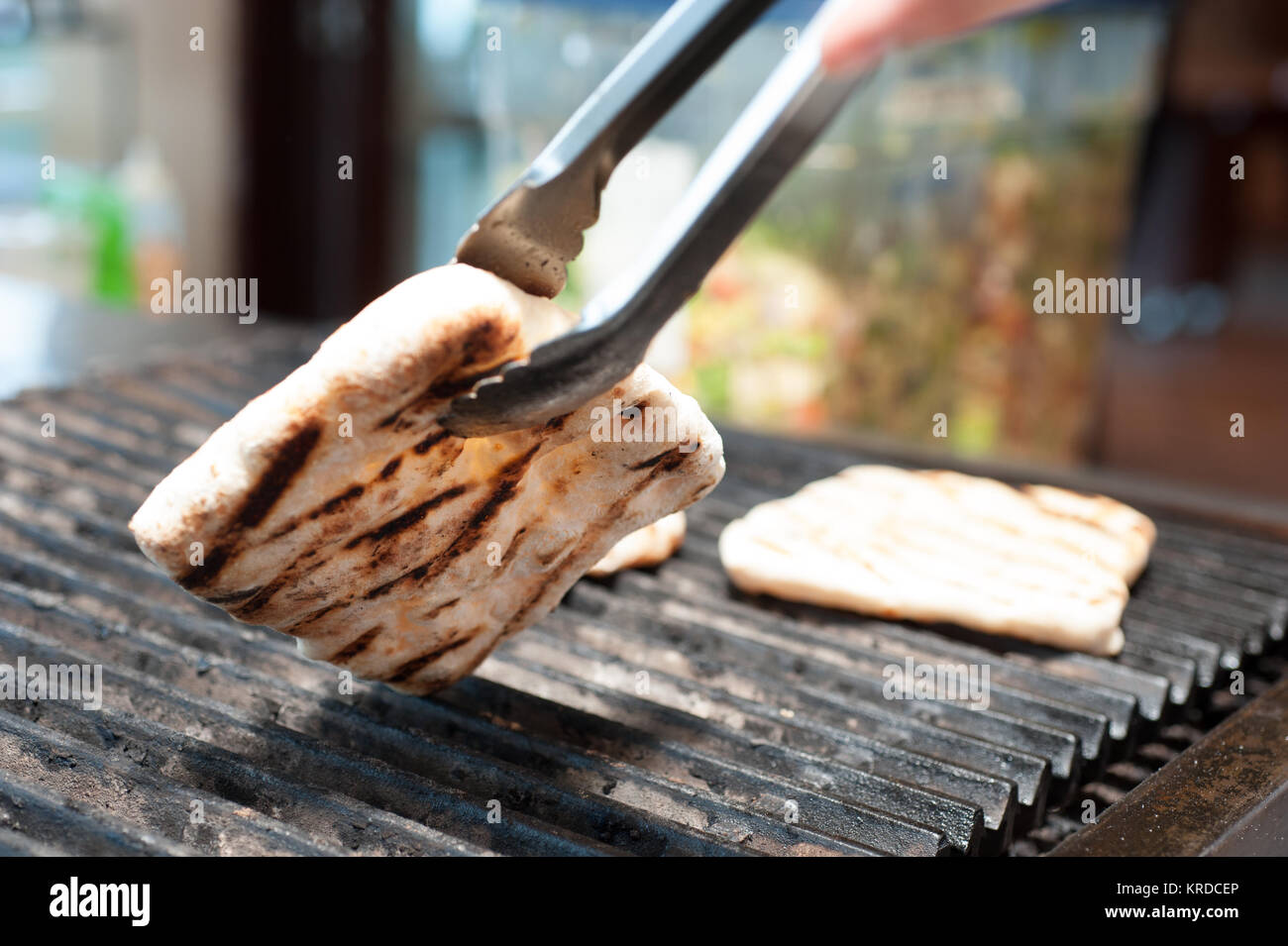 Pita bread on a grill Stock Photo Alamy