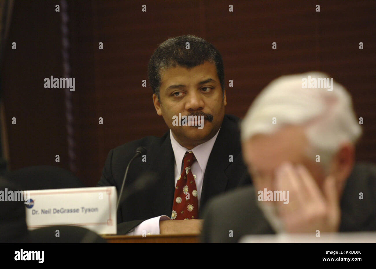 Dr. Neil DeGrasse Tyson, NASA advisory Council member listens during a meeting of the council at the Rayburn Building on Capitol Hill.  The NASA Advisory Council will be chaired by former Senator and Apollo astronaut Harrison H. "Jack" Schmitt. Former Apollo 11 astronaut Neil Armstrong joins Schmitt as one of the distinguished experts on the council, along with Gen. Lester L. Lyles, USAF (Ret.), former commander, Air Force Materiel Command, Wright-Patterson Air Force Base, Ohio, and Dr. Charles F. Kennel, director, Scripps Institute of Oceanography.  Photo Credit: "NASA/Bill Ingalls" Neil deGr Stock Photo