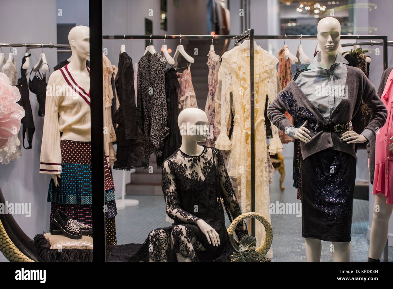 Clothing store concept mannequins in a display window Stock Photo Alamy