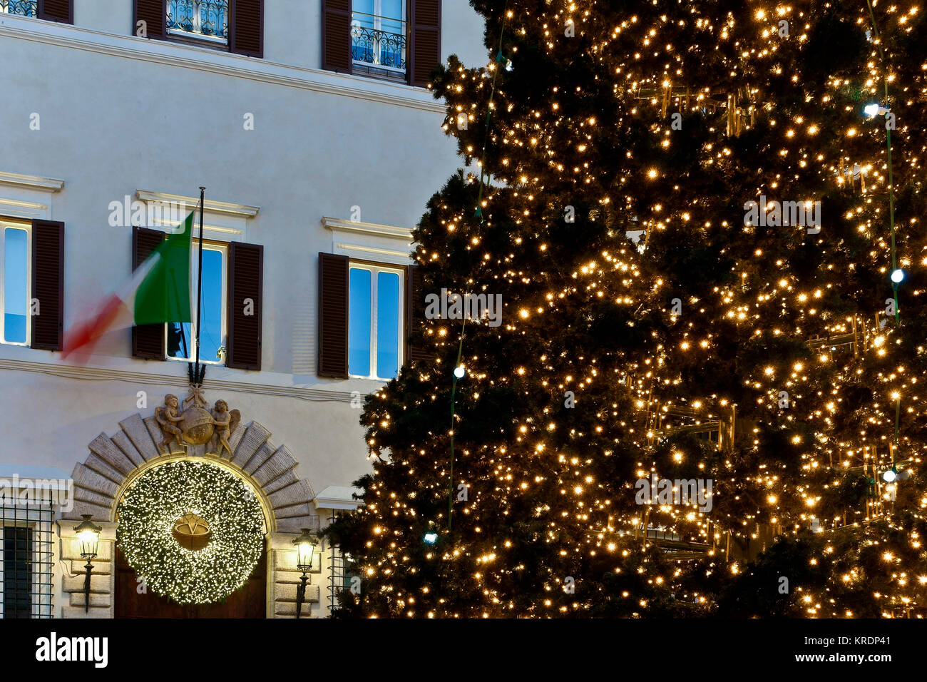 Rome Christmas led lights tree decorations, 'Valentino' palace entrance. Italy, Europe, EU. Christmas time. Low angle view, close up. Luxury shopping. Stock Photo