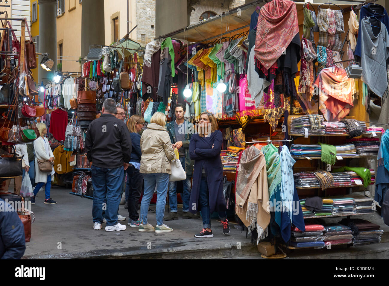 Florence, Italy, market selling leather goods with shoppers Stock Photo
