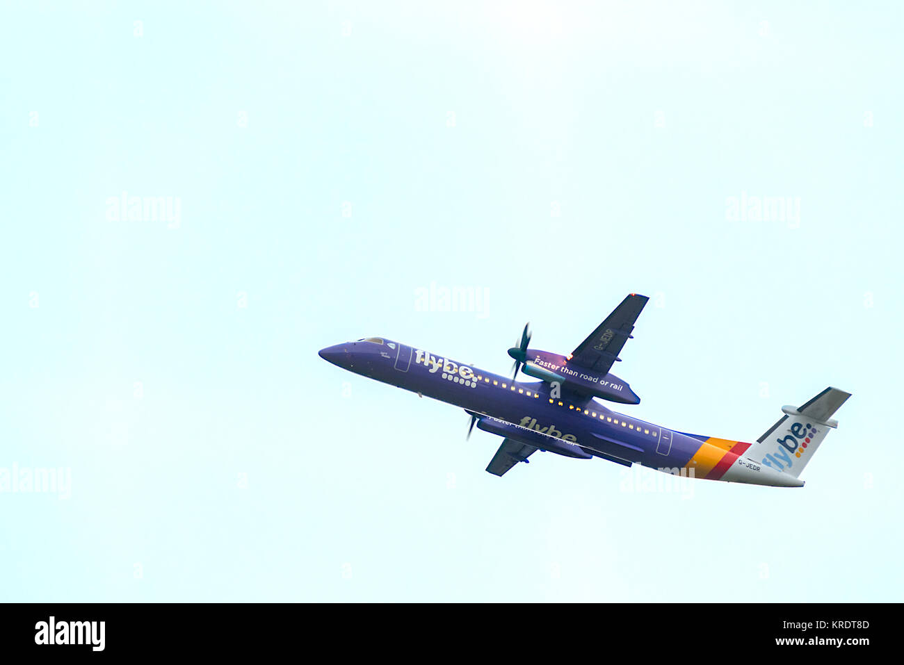 Flybe passenger airplane G-JEDR Bombardier Dash 8 Q400 flying over head after take off. Stock Photo