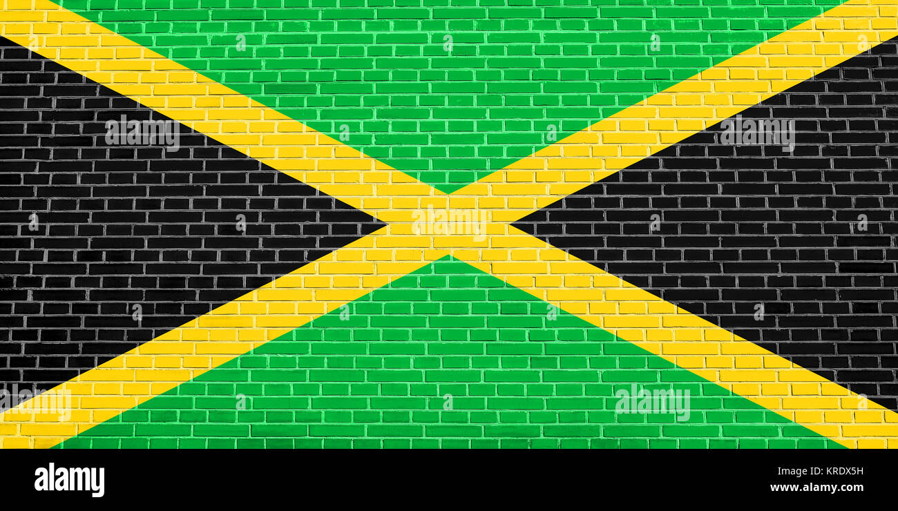 Flag of Jamaica on brick wall texture background Stock Photo - Alamy