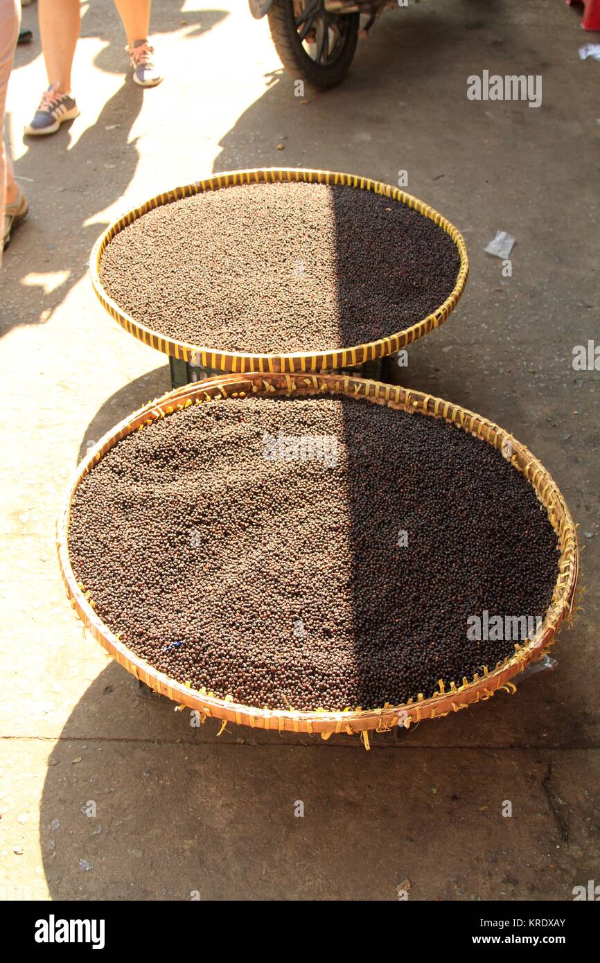 Pepper drying in baskets in the street, Duong Dong Market, Phu Quoc Island, Vietnam Stock Photo