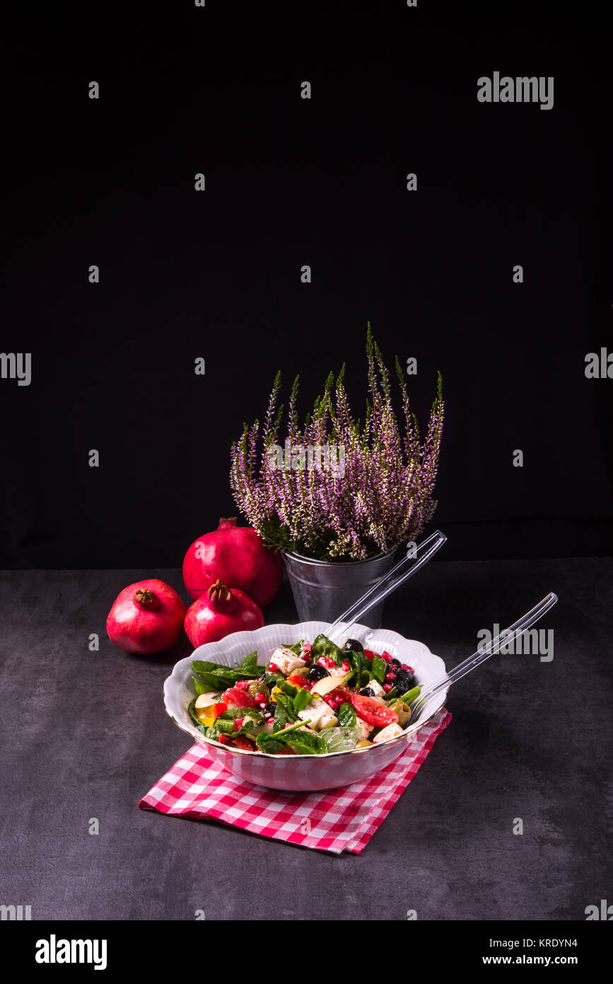 Green Spinach Salad with feta and olives Stock Photo