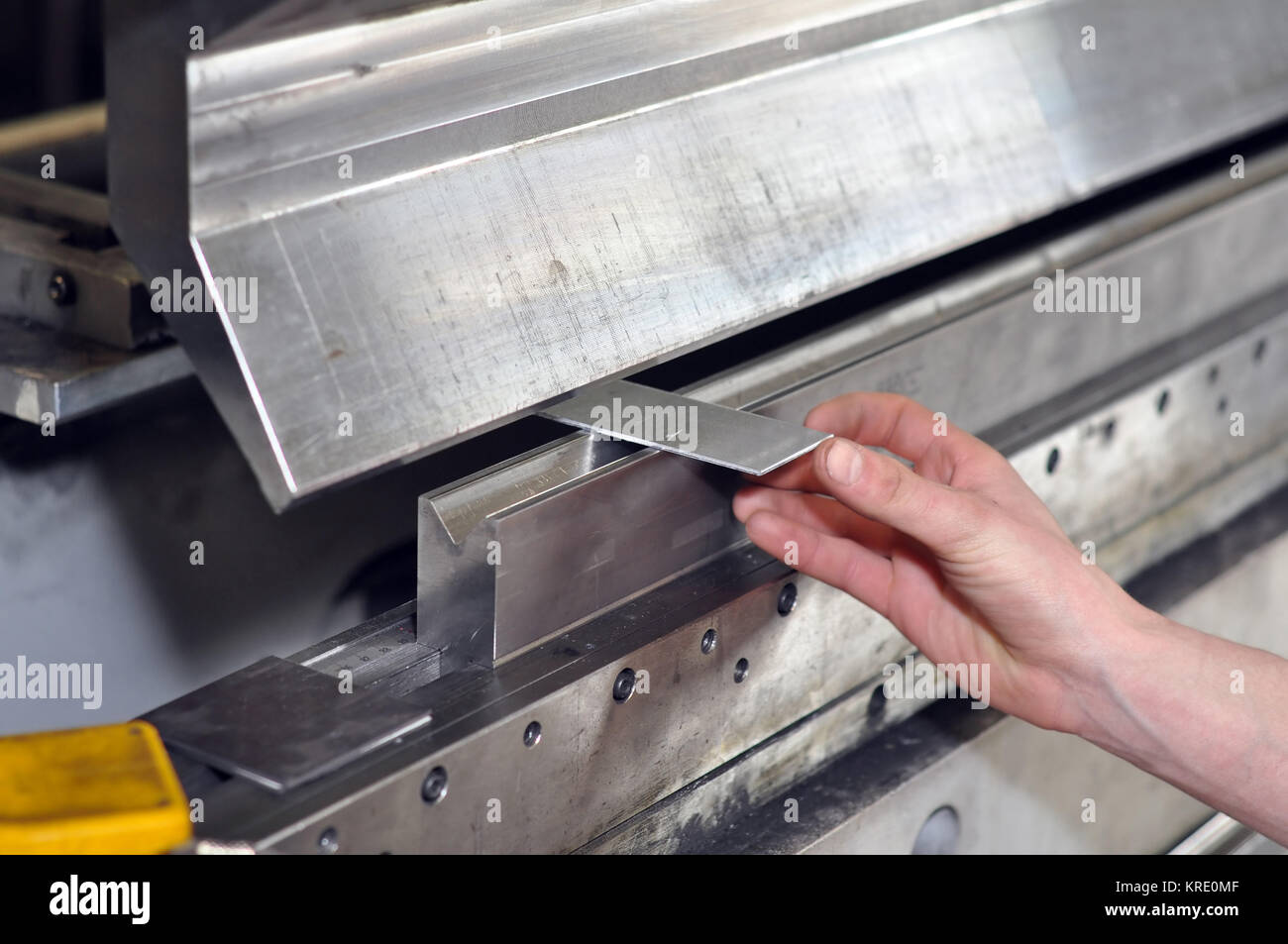 worker operates bending machine in a metal construction company Stock ...