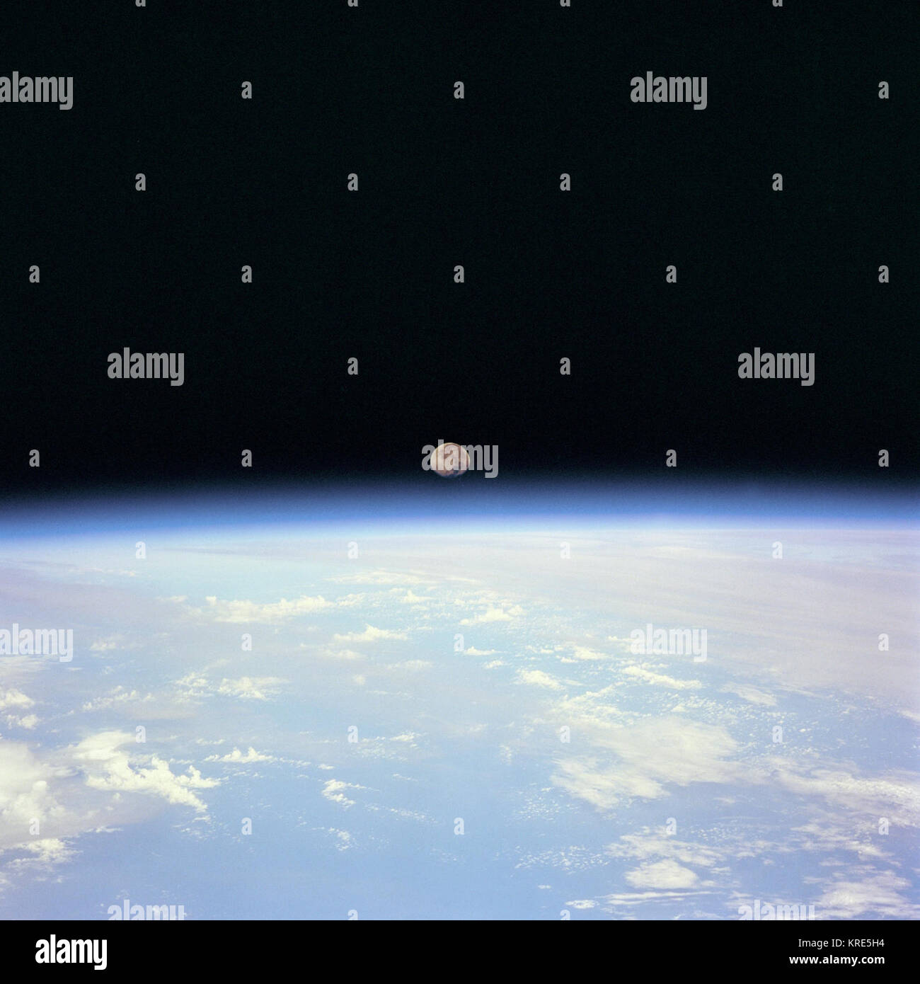 Moon sets over Earth viewed from Space Shuttle Discovery on STS-70 Photo Print