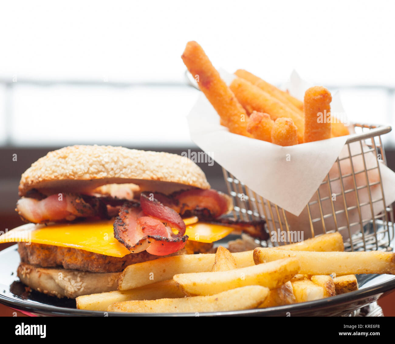Bacon cheeseburger with fries Stock Photo Alamy