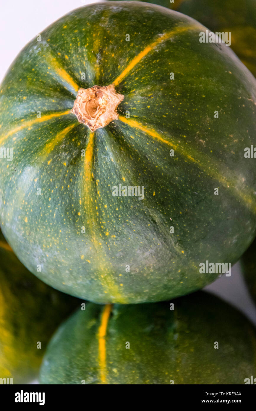 Pumpkin, gem squash, macro. Clouseup of green and yellow vegetable, cucurbita pepo. Stock Photo