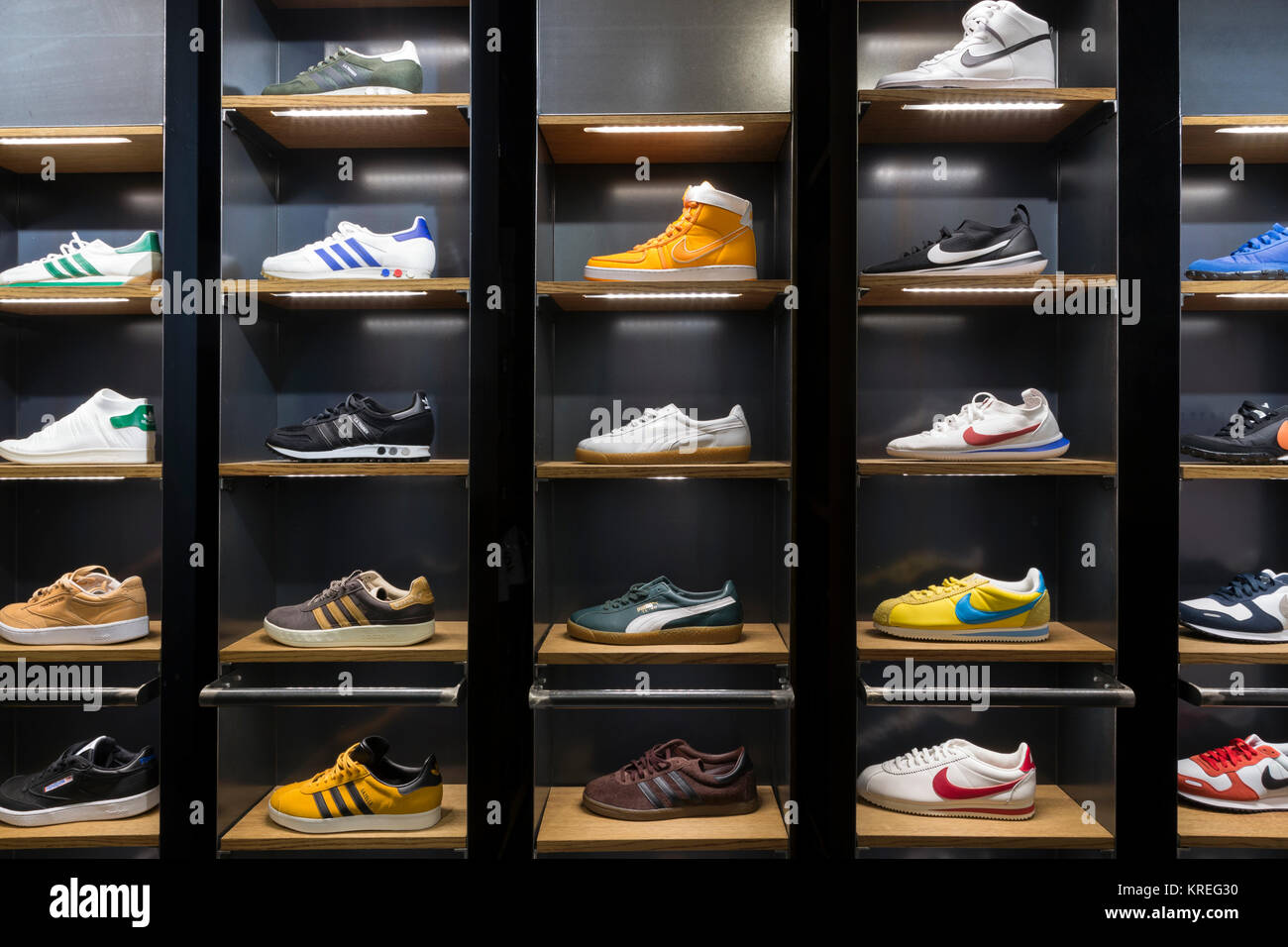 maldición dejar Resbaladizo Sneakers shoes in shelves of a store, Milano, Italy Stock Photo - Alamy