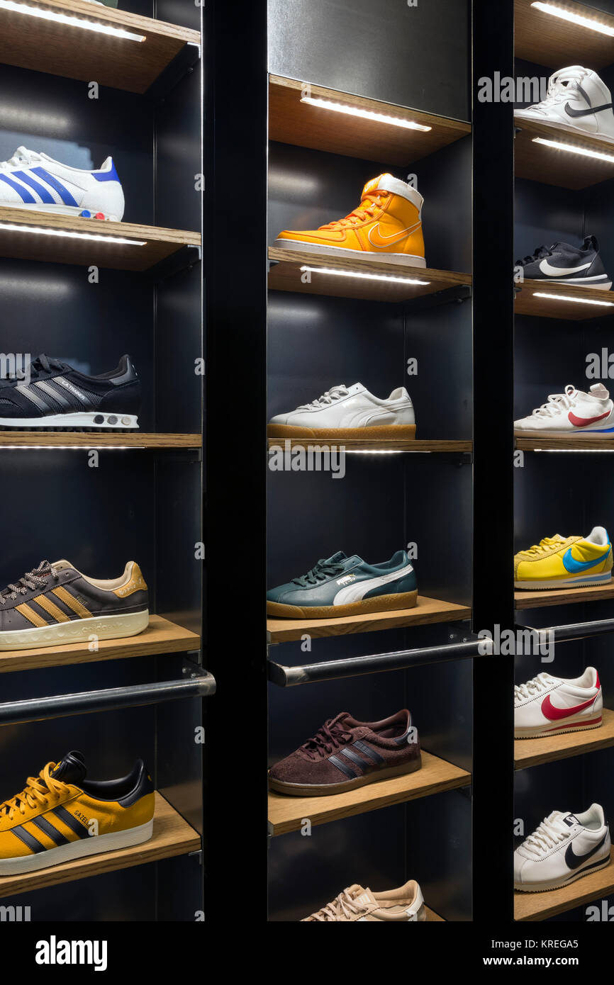 Sneakers shoes in shelves of a store, Milano, Italy Stock Photo - Alamy