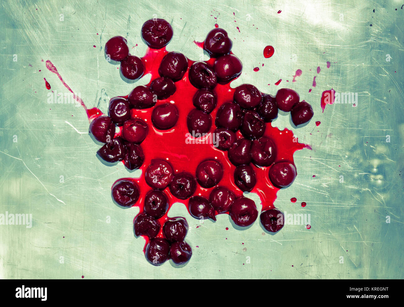 Splashed sour cherries on metallic surface sour cherry fruits Stock