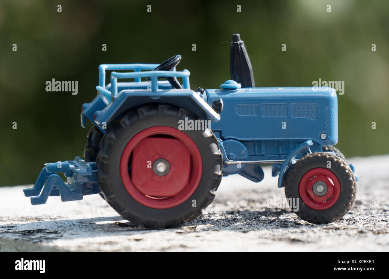 Scale model of blue farm tractor Stock Photo Alamy
