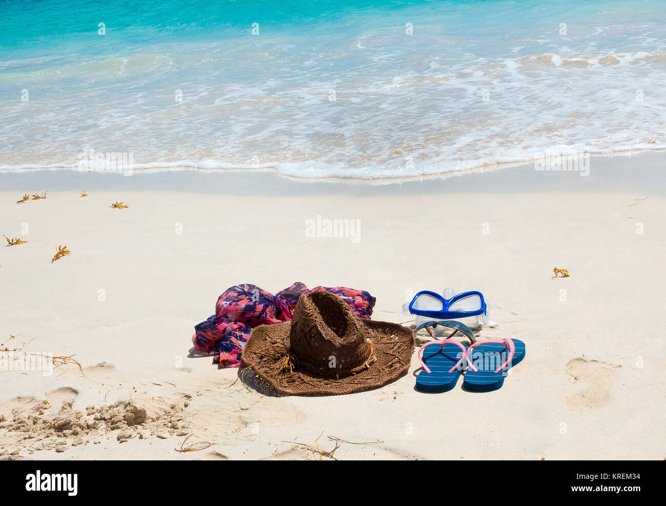 Straw hat, mask. sunglasses and flip flops on a tropical beach Stock ...