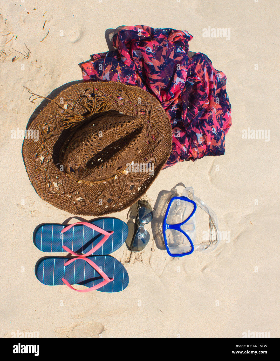 Straw hat, mask. sunglasses and flip flops on a tropical beach Stock ...