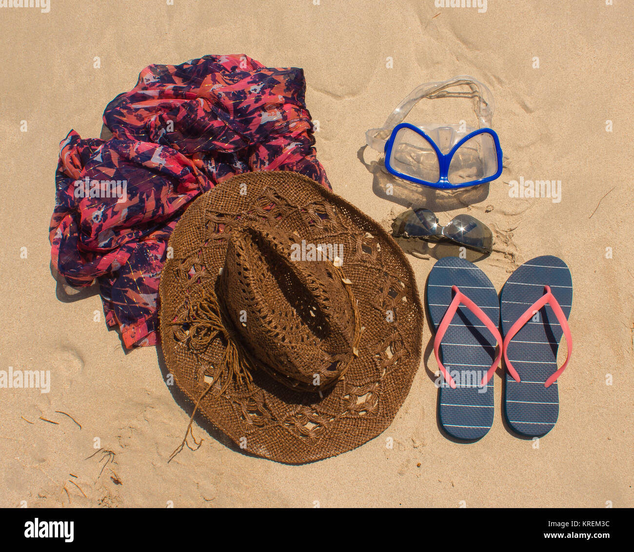 Straw hat, mask. sunglasses and flip flops on a tropical beach Stock ...