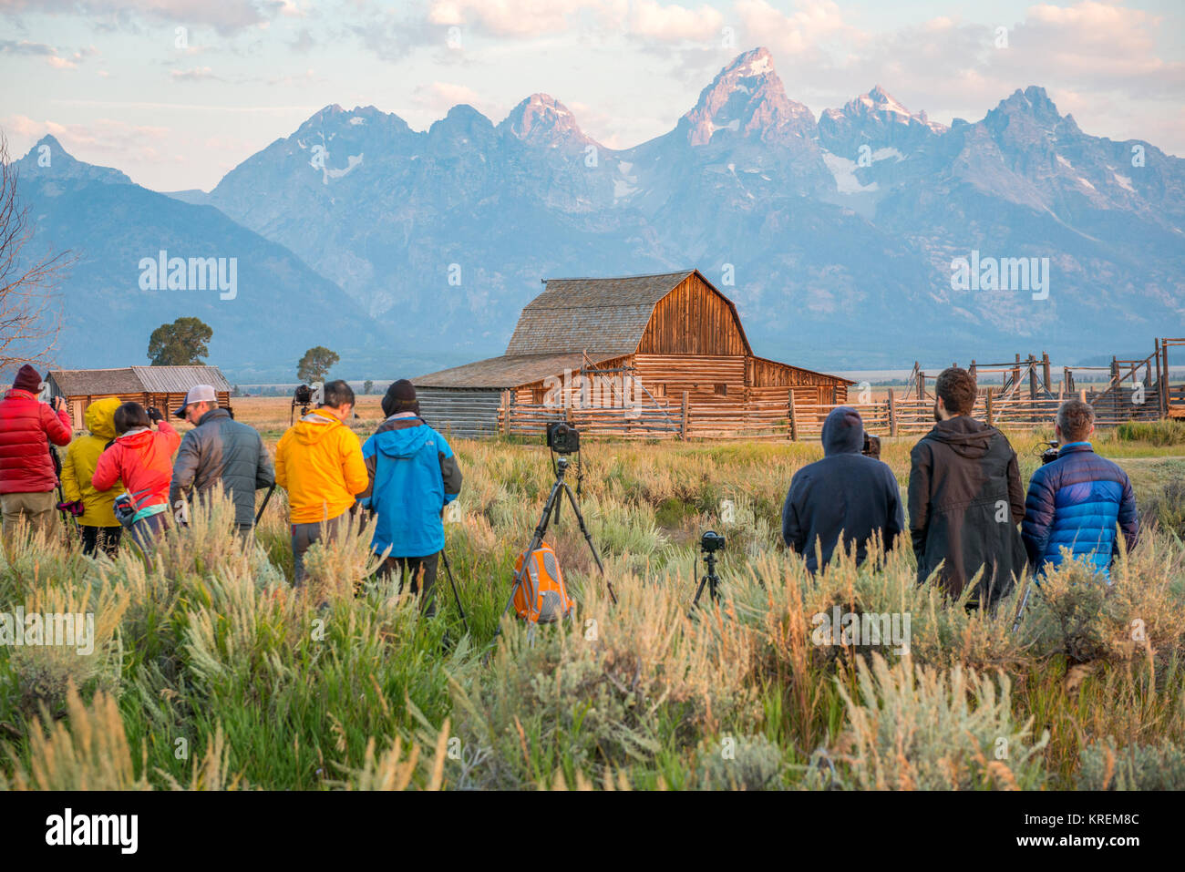 Group of photographers set up cameras in front of John Moulton Barn and