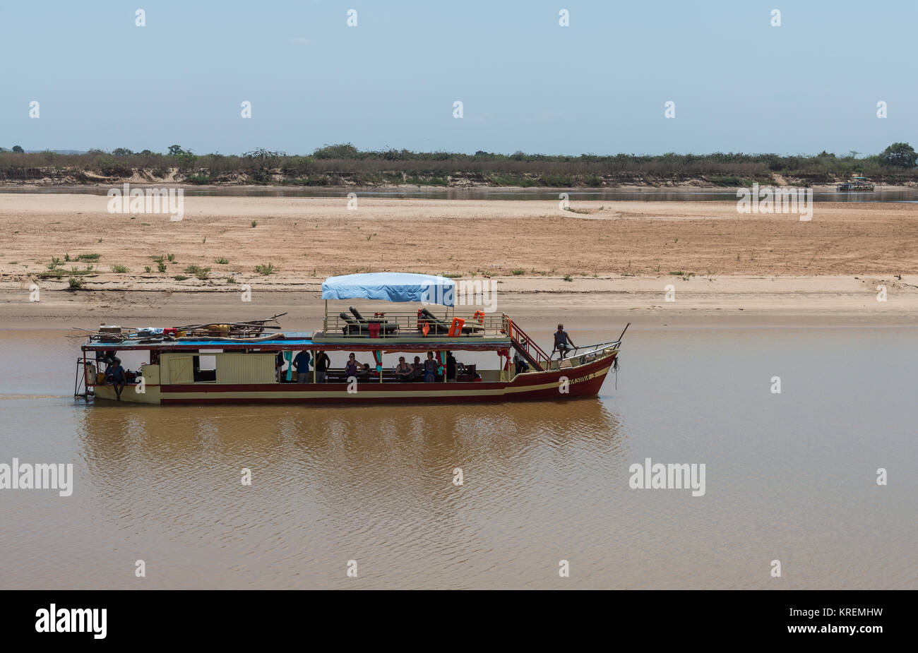 River cruise carries tourists along Mania River. Madagascar, Africa. Stock Photo